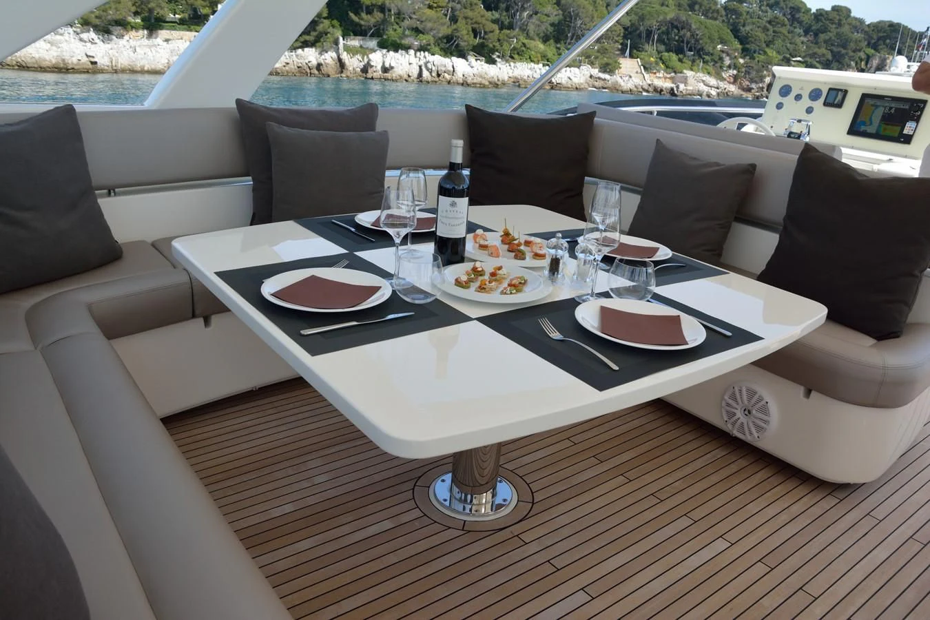 a table with plates and glasses on it aboard HEAL Yacht for Sale
