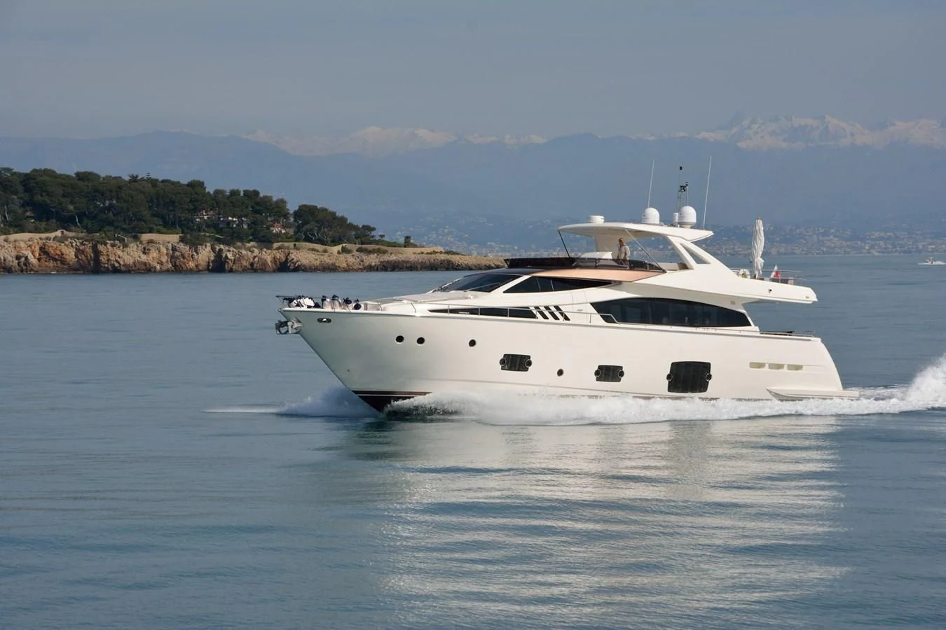 a white yacht on the water aboard HEAL Yacht for Sale