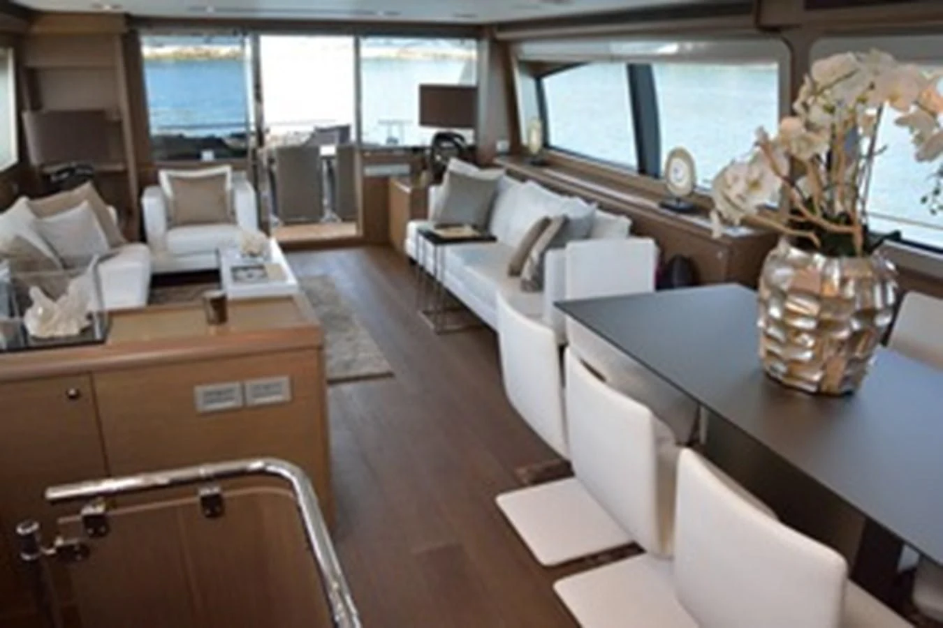 a room with a bed and desk aboard HEAL Yacht for Sale