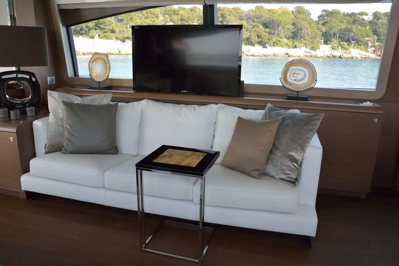 a couch with a tv on top of it aboard HEAL Yacht for Sale