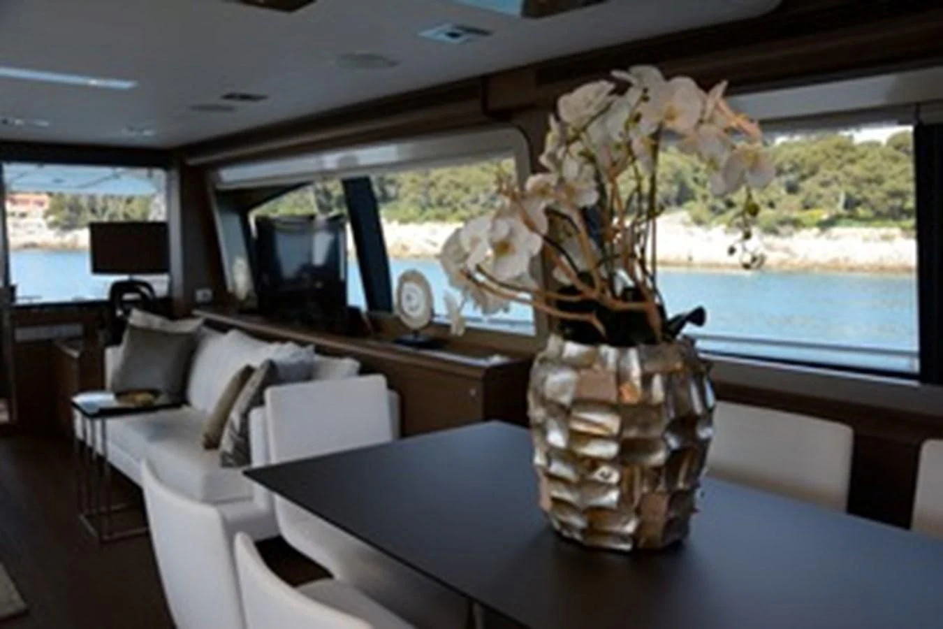 a vase with flowers in it aboard HEAL Yacht for Sale