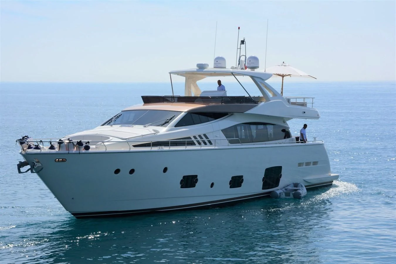 a white yacht on the water aboard HEAL Yacht for Sale