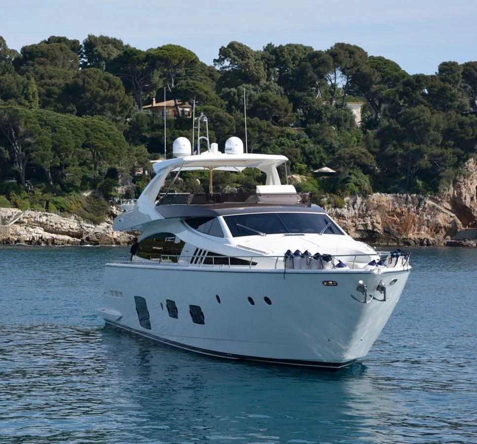 a white boat in the water aboard HEAL Yacht for Sale