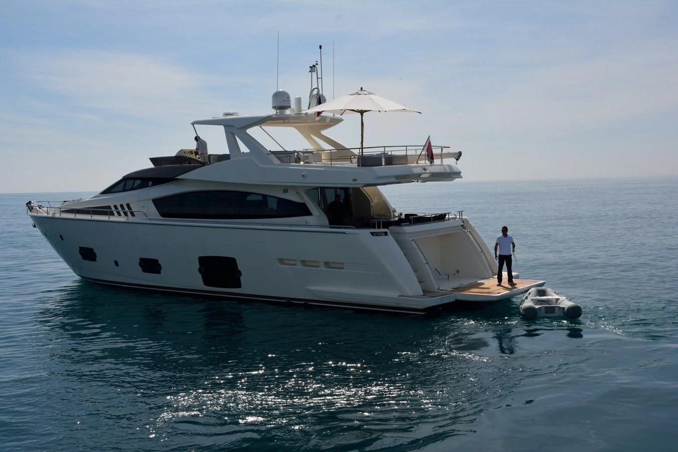 a white yacht in the water aboard HEAL Yacht for Sale