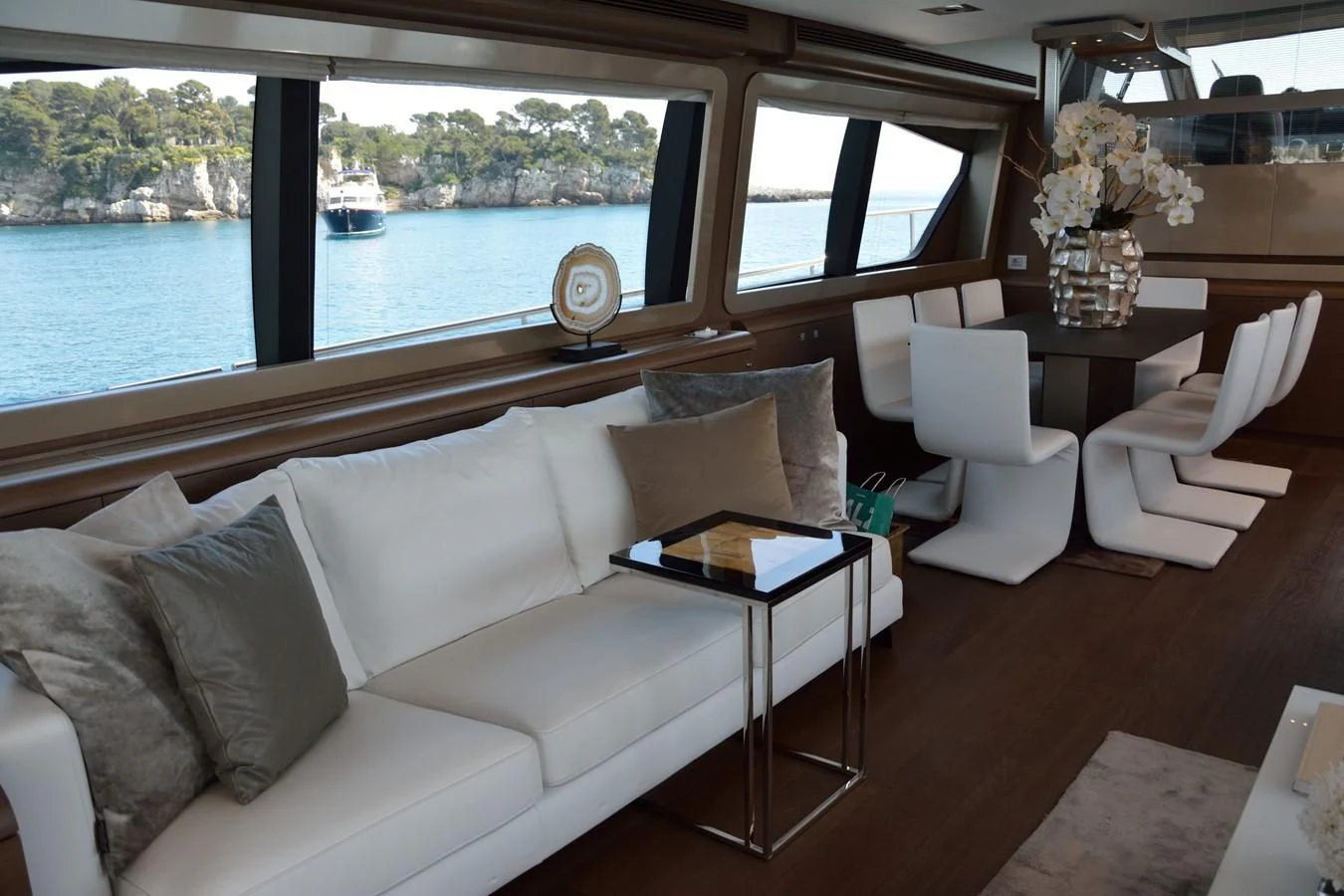 a living room with a large window aboard HEAL Yacht for Sale