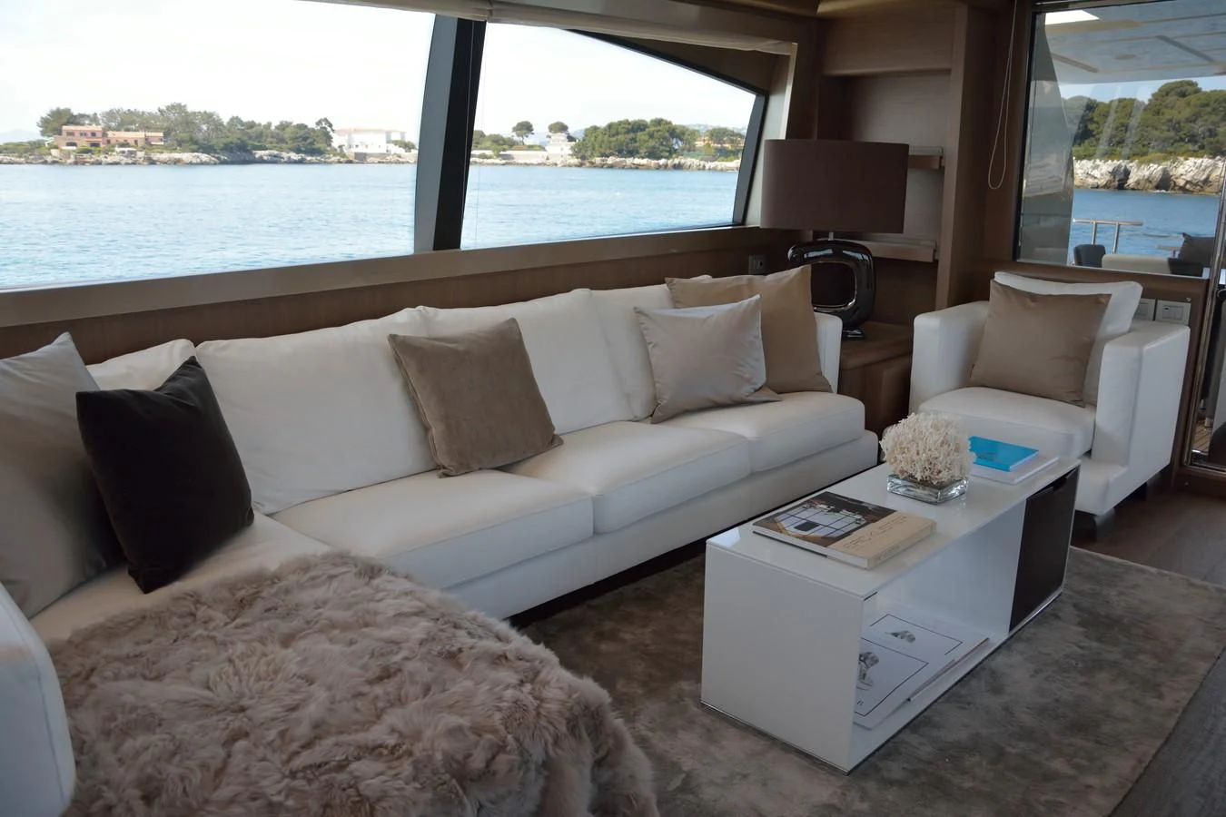 a living room with a large window aboard HEAL Yacht for Sale
