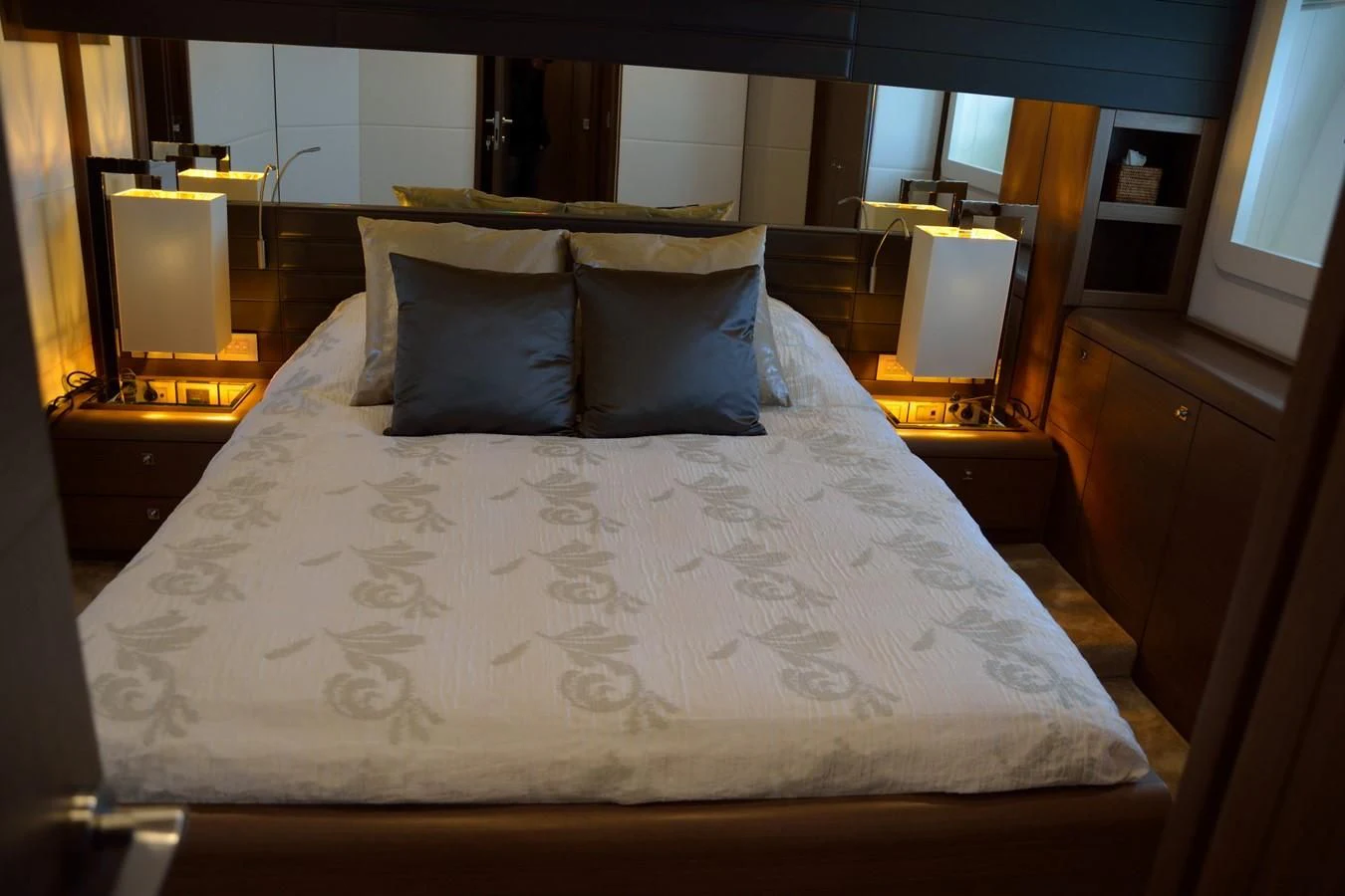 a bed with white sheets aboard HEAL Yacht for Sale