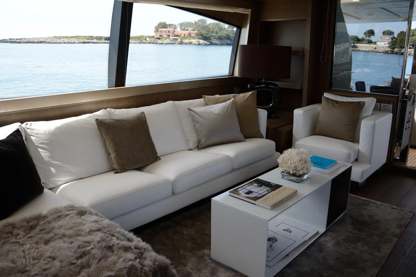 a living room with a large window aboard HEAL Yacht for Sale