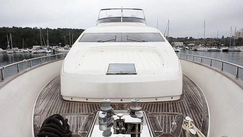 a white yacht on a dock aboard ALDA 2 Yacht for Sale