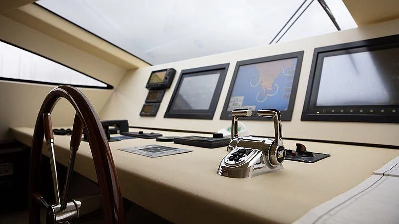 a desk with a computer and a lamp on it aboard ALDA 2 Yacht for Sale