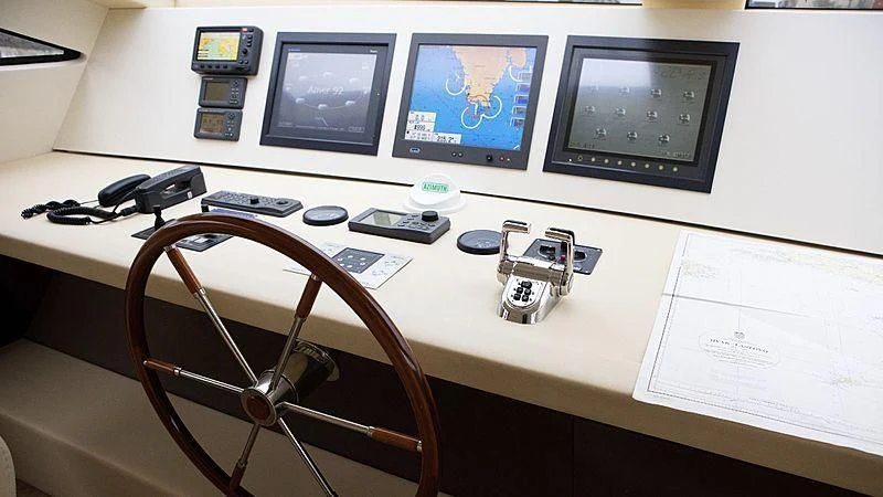 a desk with a computer and a camera on it aboard ALDA 2 Yacht for Sale
