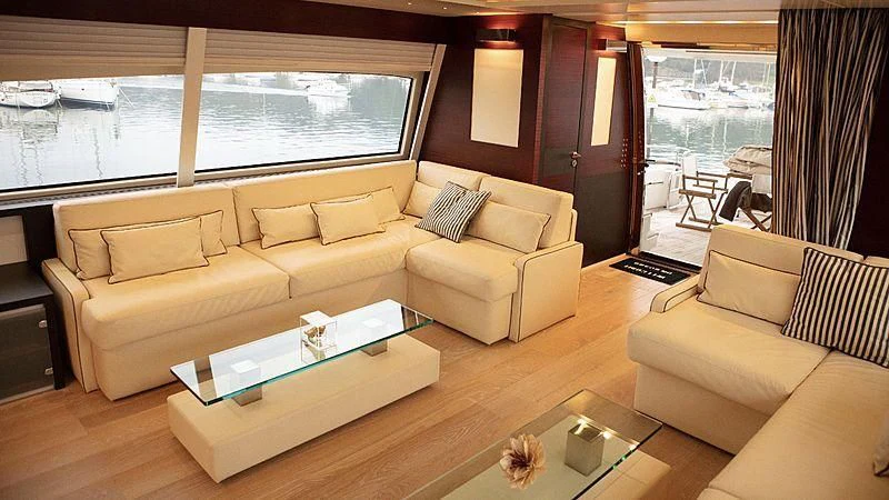 a living room with a couch and a table aboard ALDA 2 Yacht for Sale