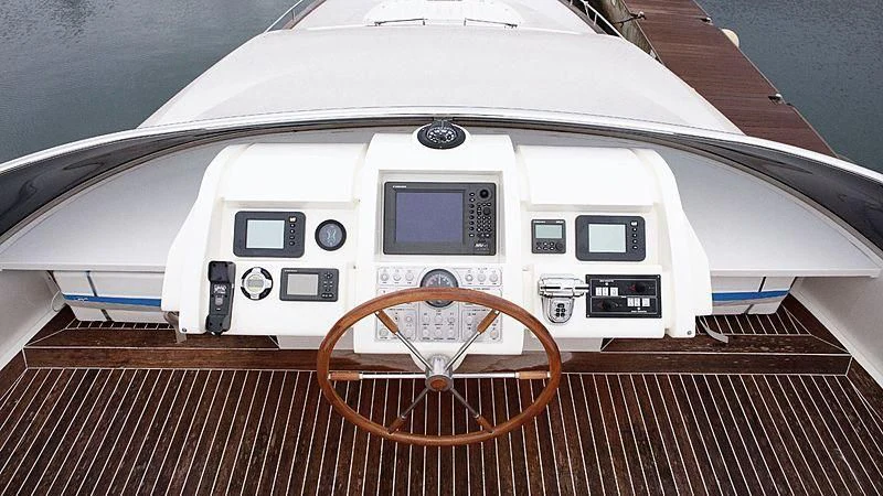 a white train with a red wheel aboard ALDA 2 Yacht for Sale