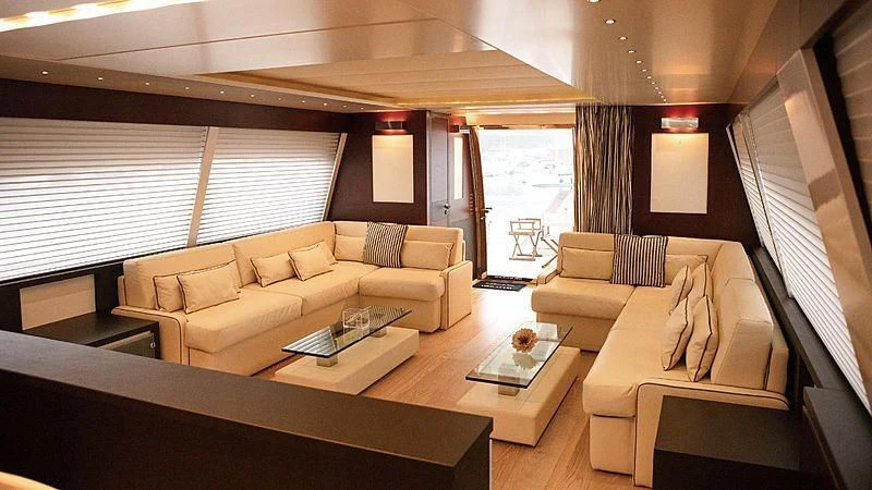 a living room with a couch and a coffee table aboard ALDA 2 Yacht for Sale