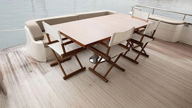 a table with chairs on it aboard ALDA 2 Yacht for Sale