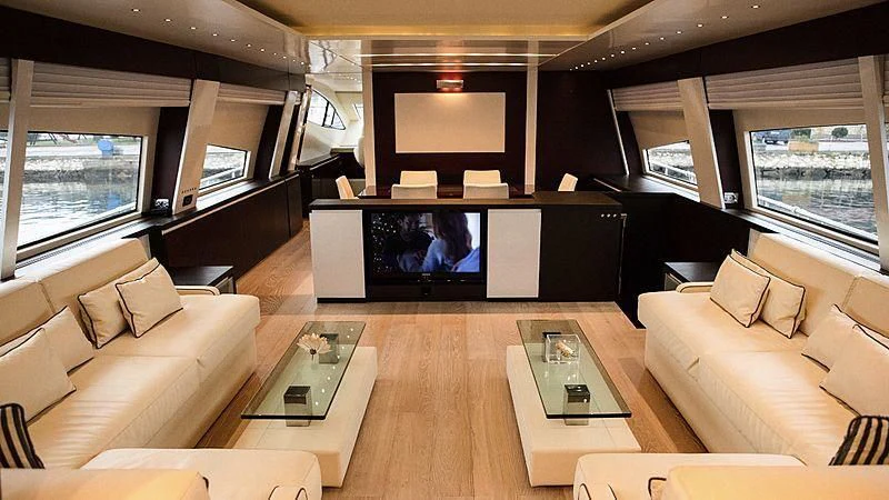 a living room with a large television aboard ALDA 2 Yacht for Sale