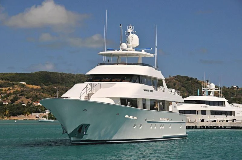 a couple of boats in the water aboard EXCELLENCE Yacht for Sale