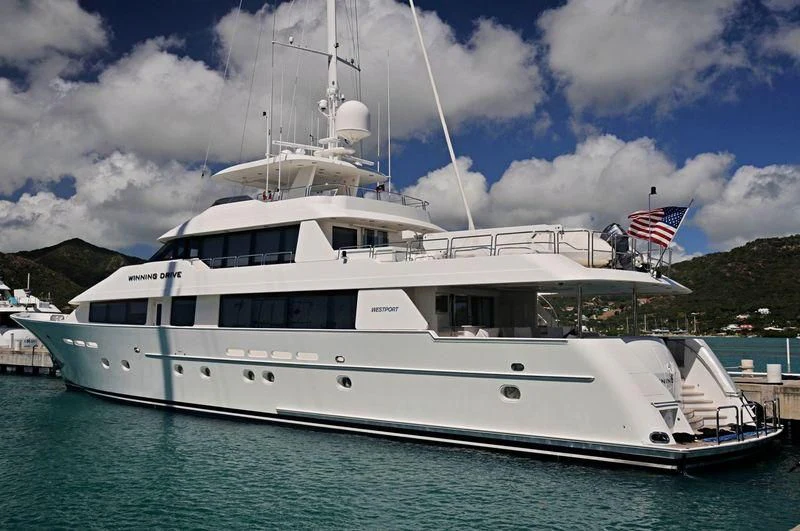 a large white boat with flags on it aboard EXCELLENCE Yacht for Sale