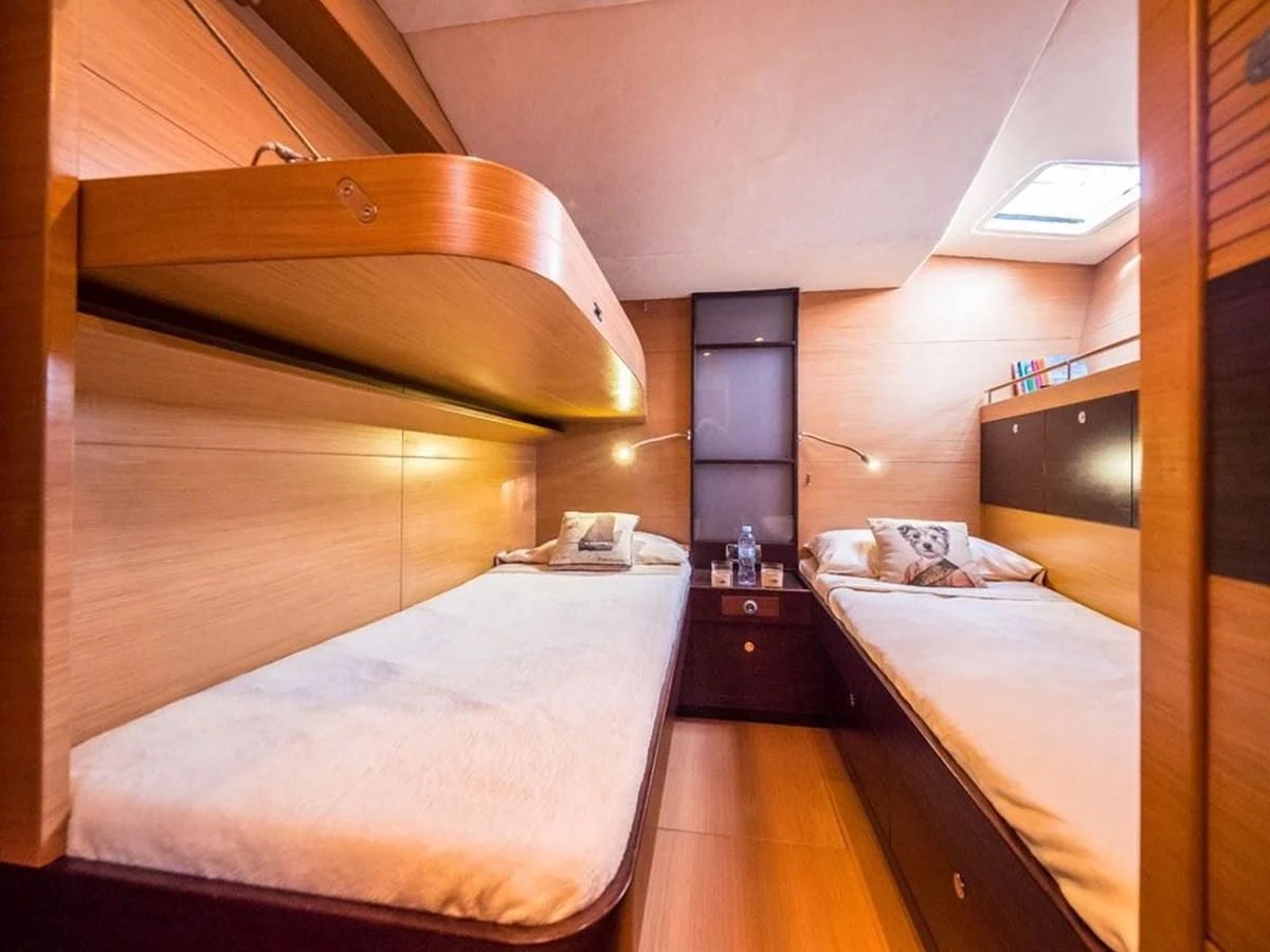 a room with two beds aboard KALINDA Yacht for Sale