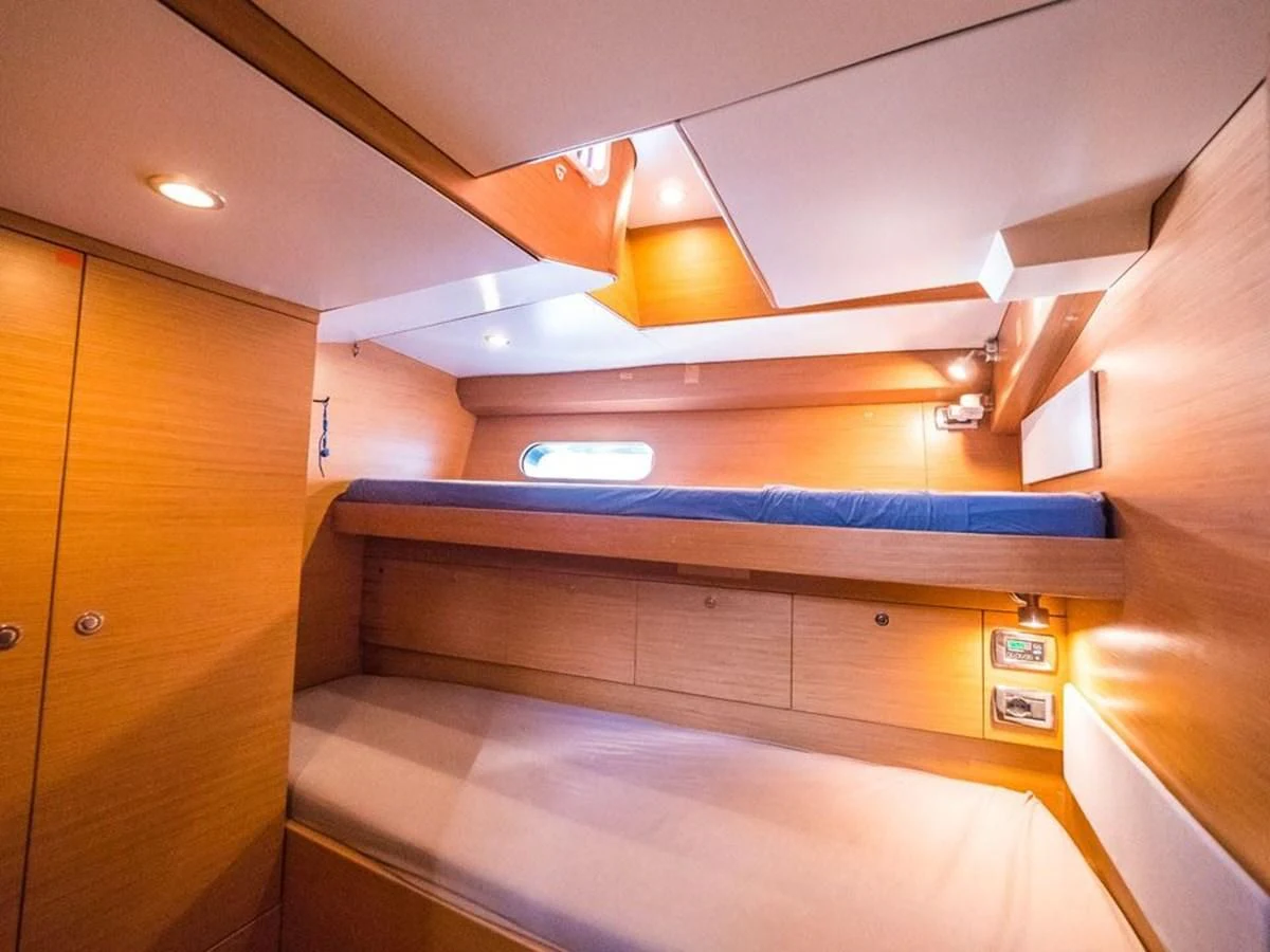 a kitchen with wooden cabinets aboard KALINDA Yacht for Sale