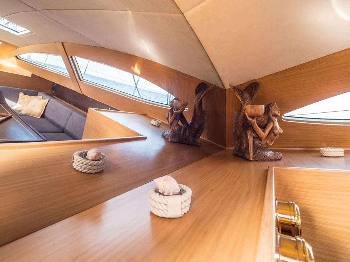 a group of people in a room aboard KALINDA Yacht for Sale