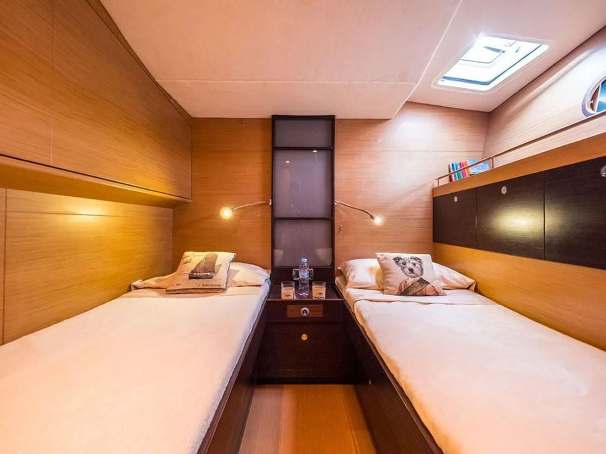 a room with two beds aboard KALINDA Yacht for Sale