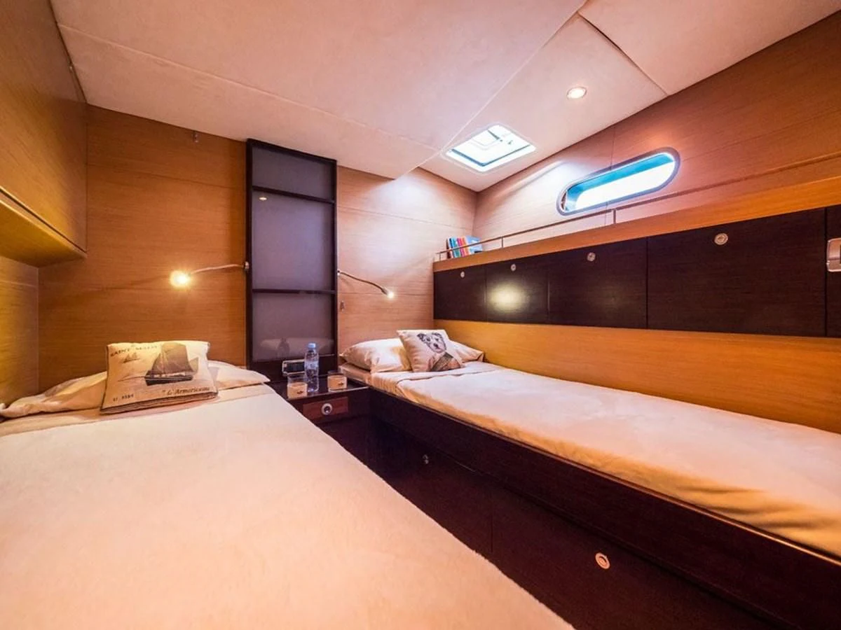a room with two beds aboard KALINDA Yacht for Sale