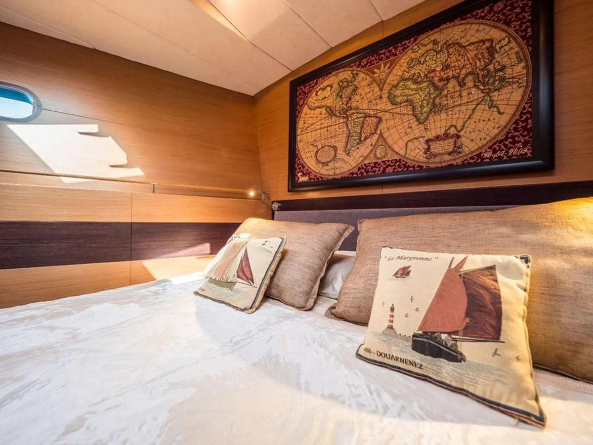 a bed with pillows aboard KALINDA Yacht for Sale