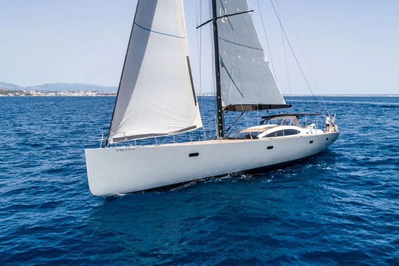 a white boat on the water aboard KALINDA Yacht for Sale