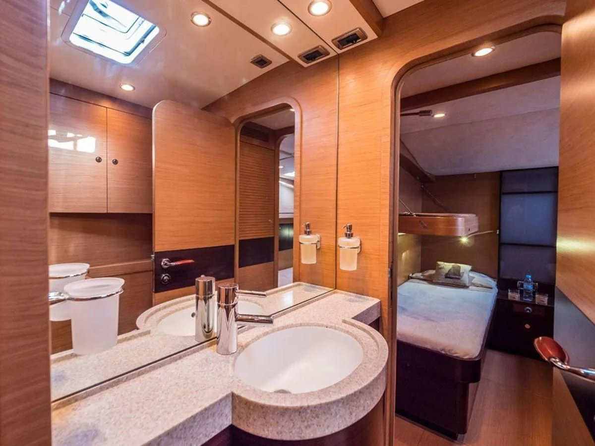 a bathroom with a large mirror aboard KALINDA Yacht for Sale