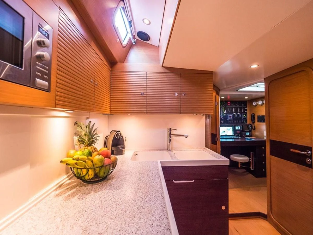 a kitchen with a marble counter top aboard KALINDA Yacht for Sale