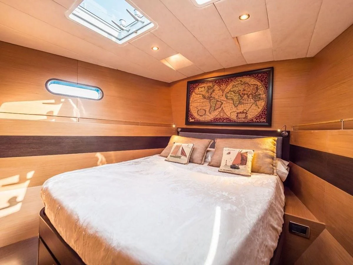 a bed in a room aboard KALINDA Yacht for Sale