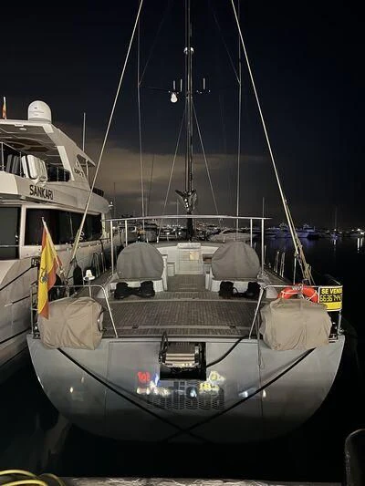 a boat with a flag on it aboard KALINDA Yacht for Sale