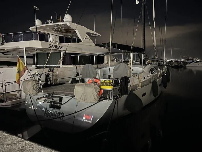 a boat docked at night aboard KALINDA Yacht for Sale