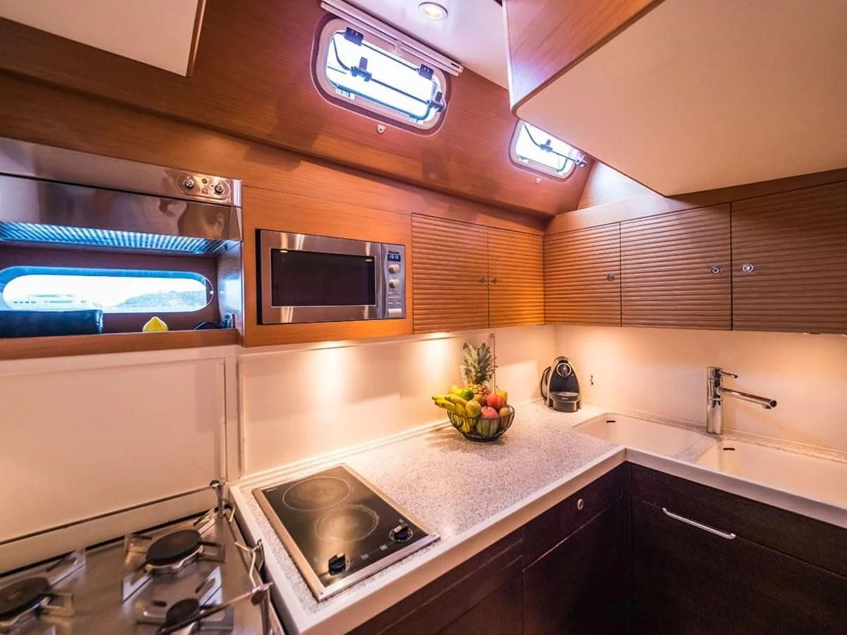 a kitchen with a microwave oven and a microwave aboard KALINDA Yacht for Sale