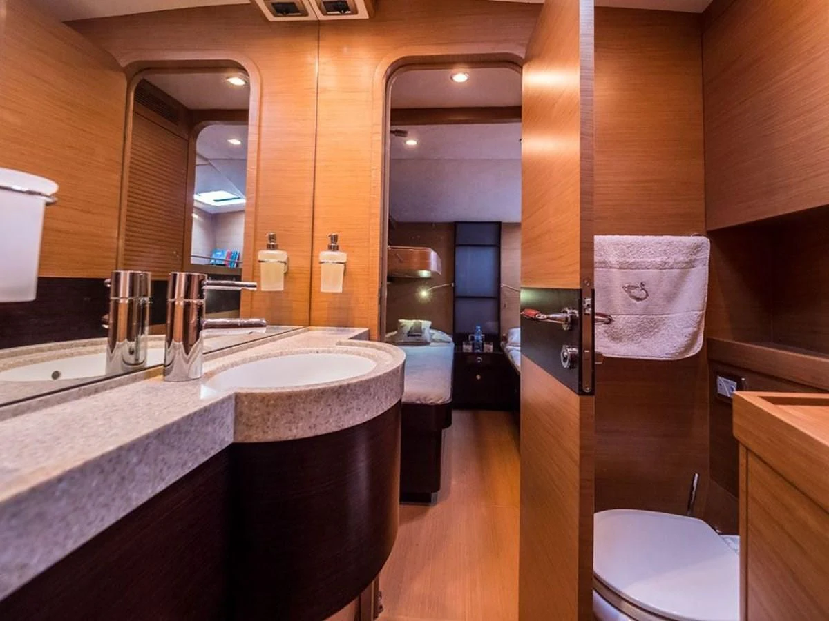a bathroom with a countertop sink and a toilet aboard KALINDA Yacht for Sale