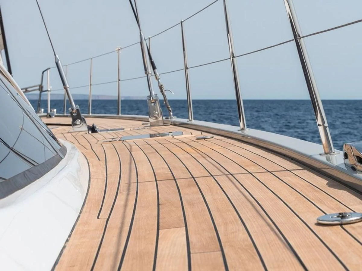 a deck with a large body of water and a boat in the background aboard KALINDA Yacht for Sale