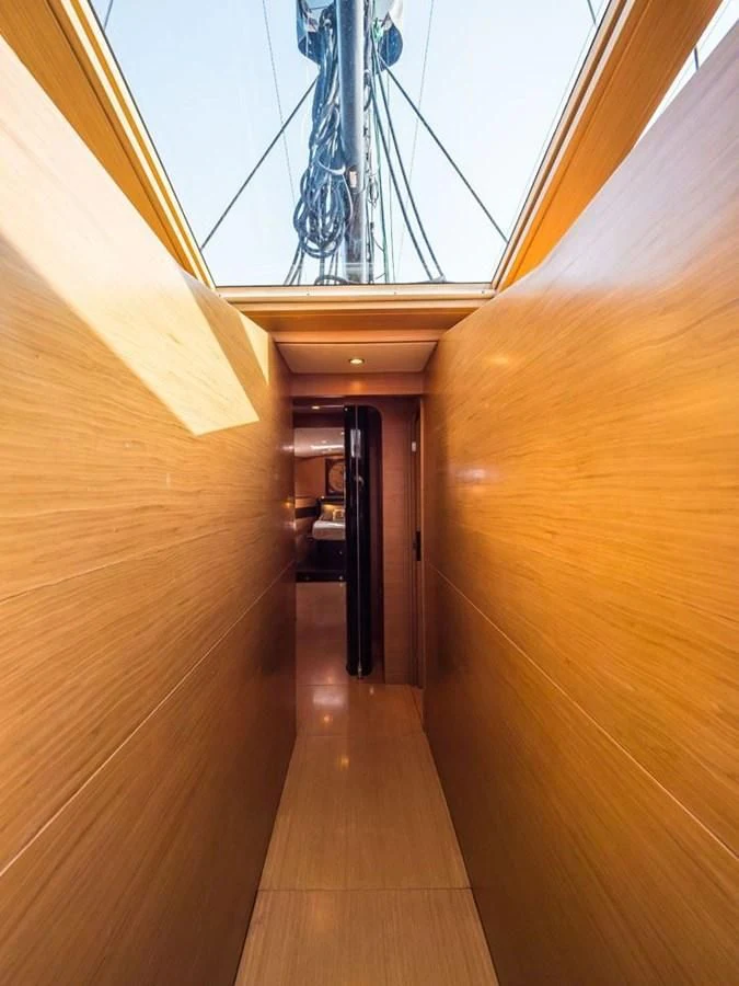 a wood hallway with a large mirror aboard KALINDA Yacht for Sale