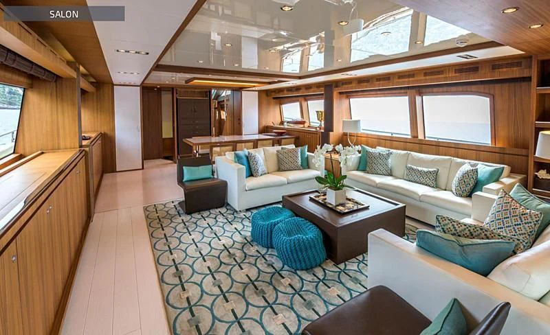 a room with a couch and a table aboard RUFF ONE II Yacht for Sale
