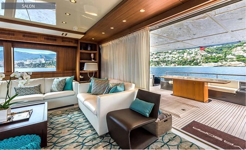 a living room with a couch and a table aboard RUFF ONE II Yacht for Sale