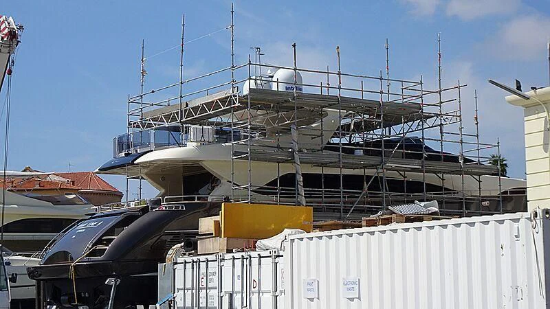 a large ship in a harbor aboard RUFF ONE II Yacht for Sale