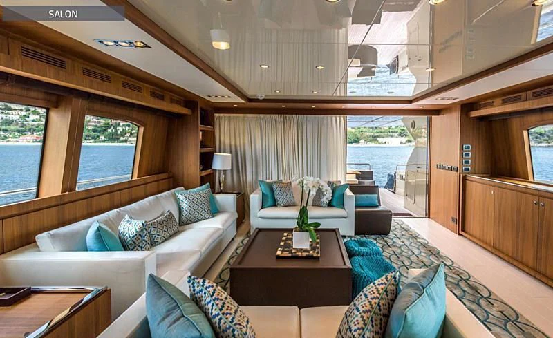 a room with a couch and a table aboard RUFF ONE II Yacht for Sale