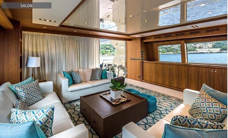 a living room with a couch and a coffee table aboard RUFF ONE II Yacht for Sale