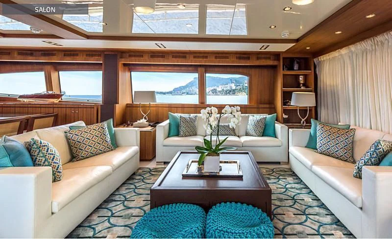 a living room with a couch and a coffee table aboard RUFF ONE II Yacht for Sale