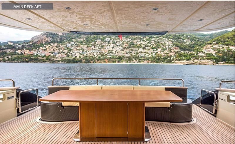 a table on a deck overlooking a city aboard RUFF ONE II Yacht for Sale