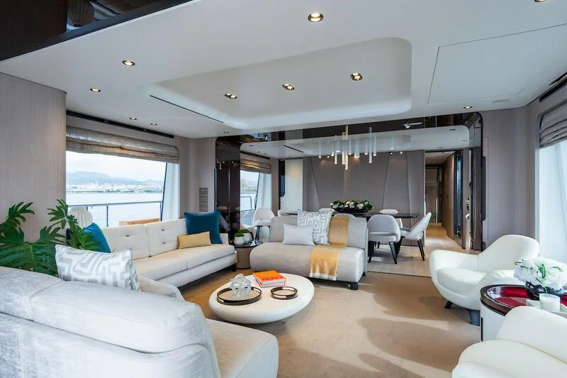 a living room with white furniture aboard AZIMUT GRANDE 27/52 Yacht for Sale