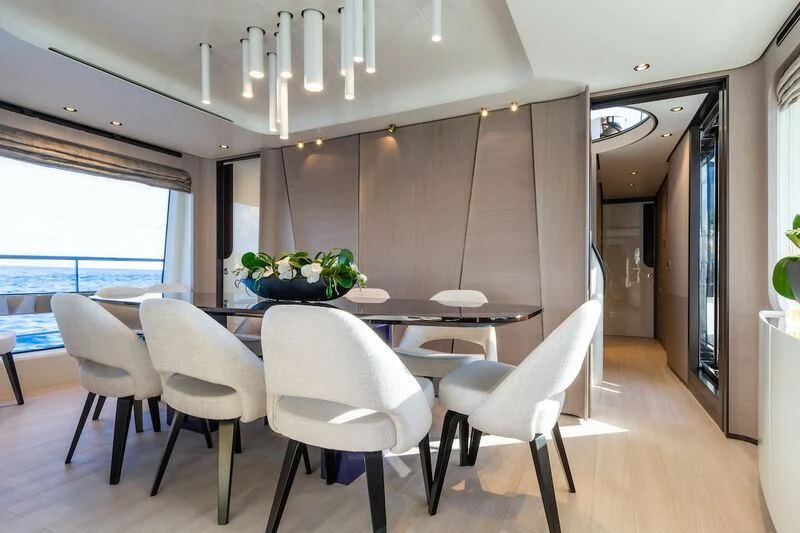 a room with a table and chairs aboard AZIMUT GRANDE 27/52 Yacht for Sale