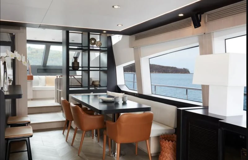 a room with a table and chairs aboard LONGREEF 90/01 SX Yacht for Sale