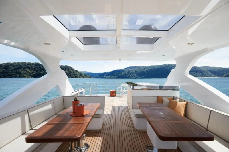 a room with a table and chairs aboard LONGREEF 90/01 SX Yacht for Sale