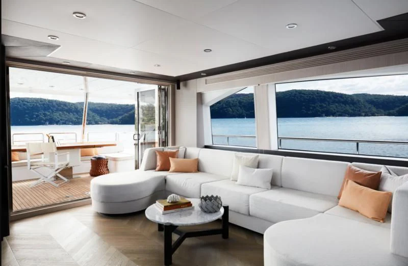 a living room with a large window aboard LONGREEF 90/01 SX Yacht for Sale